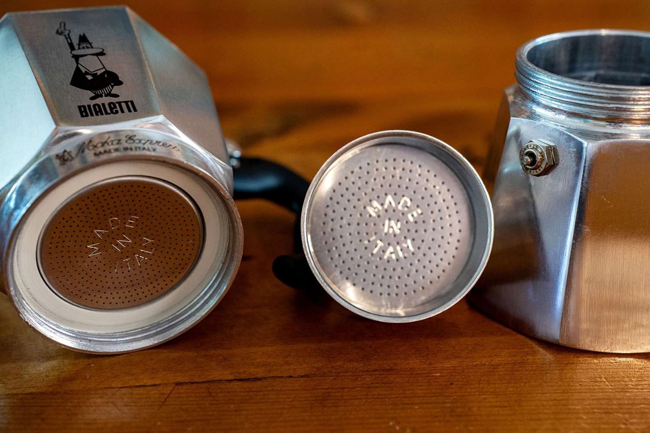 An octagonal aluminum Bialetti Moka pot taken apart