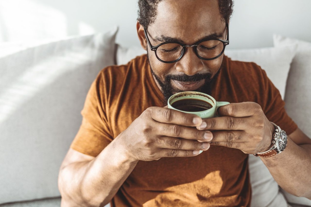 A man sipping a coffee